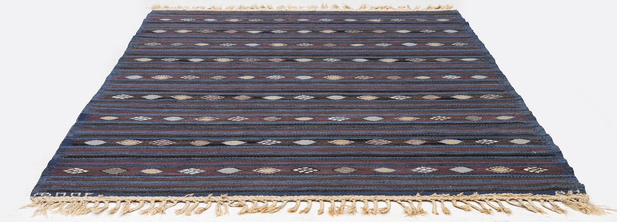 Barbro Nilsson, a carpet, 'Blåbär mörk', tapestry weave, c. 215 x 149 cm, signed AB MMF BN.