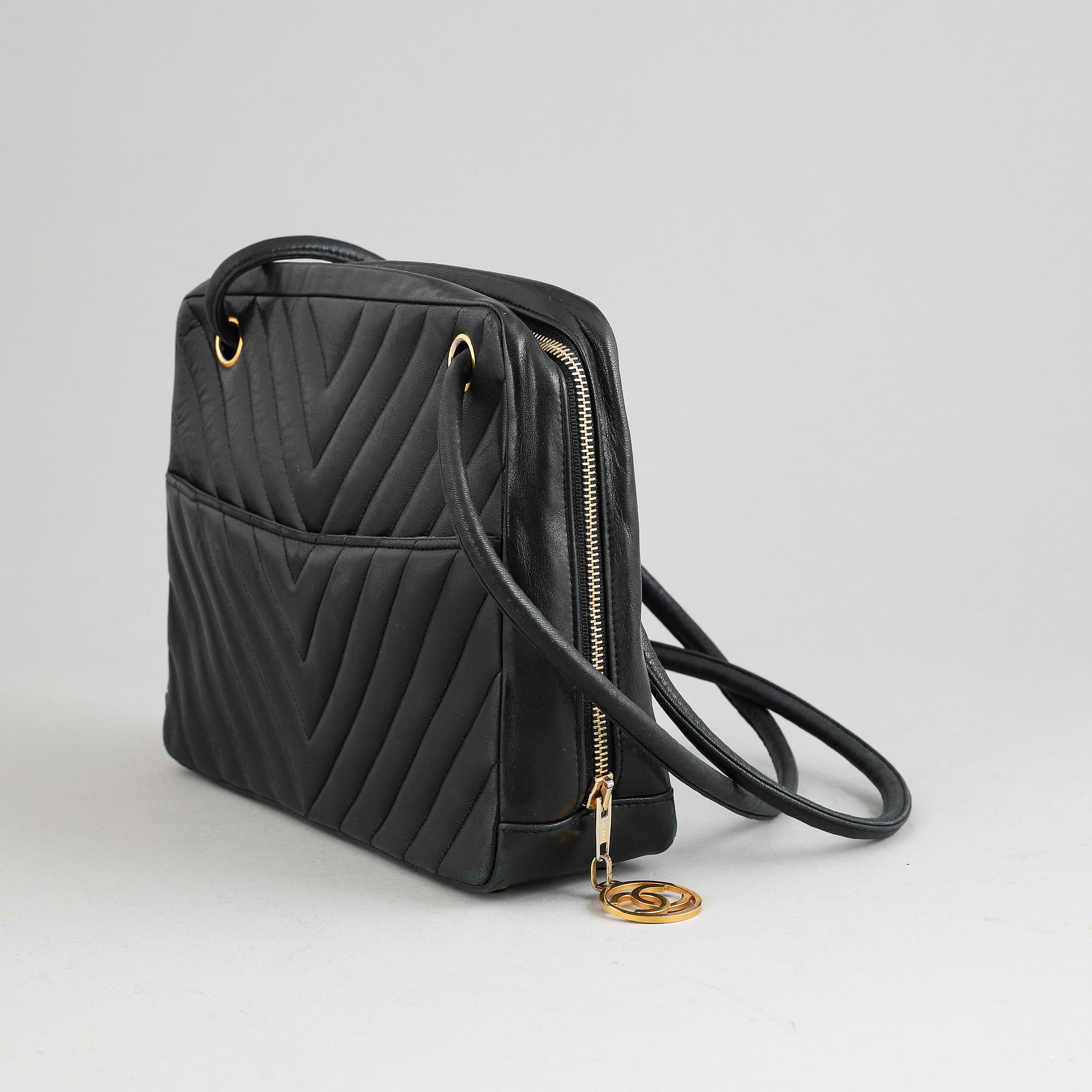 Chanel, a black leather handbag, 1980's.