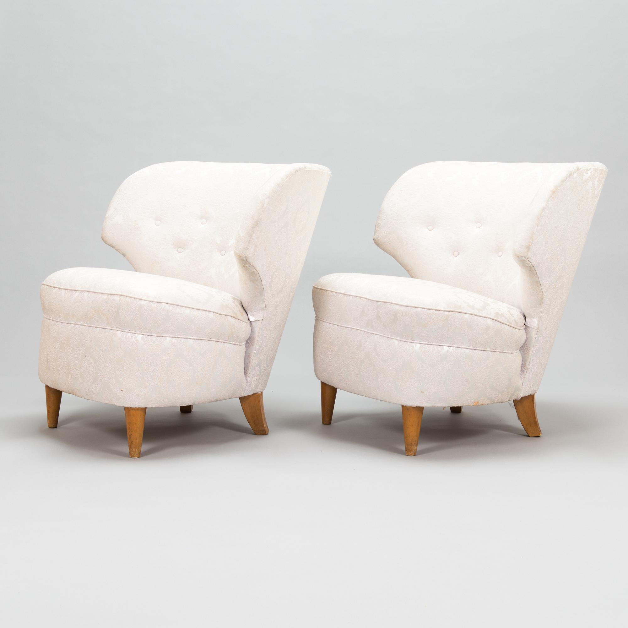 A pair of 1950's armchairs.