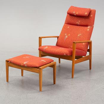 A 1950's/60's lounge chair and foot stool.