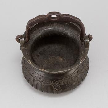 A holy water bowl dated 1620.