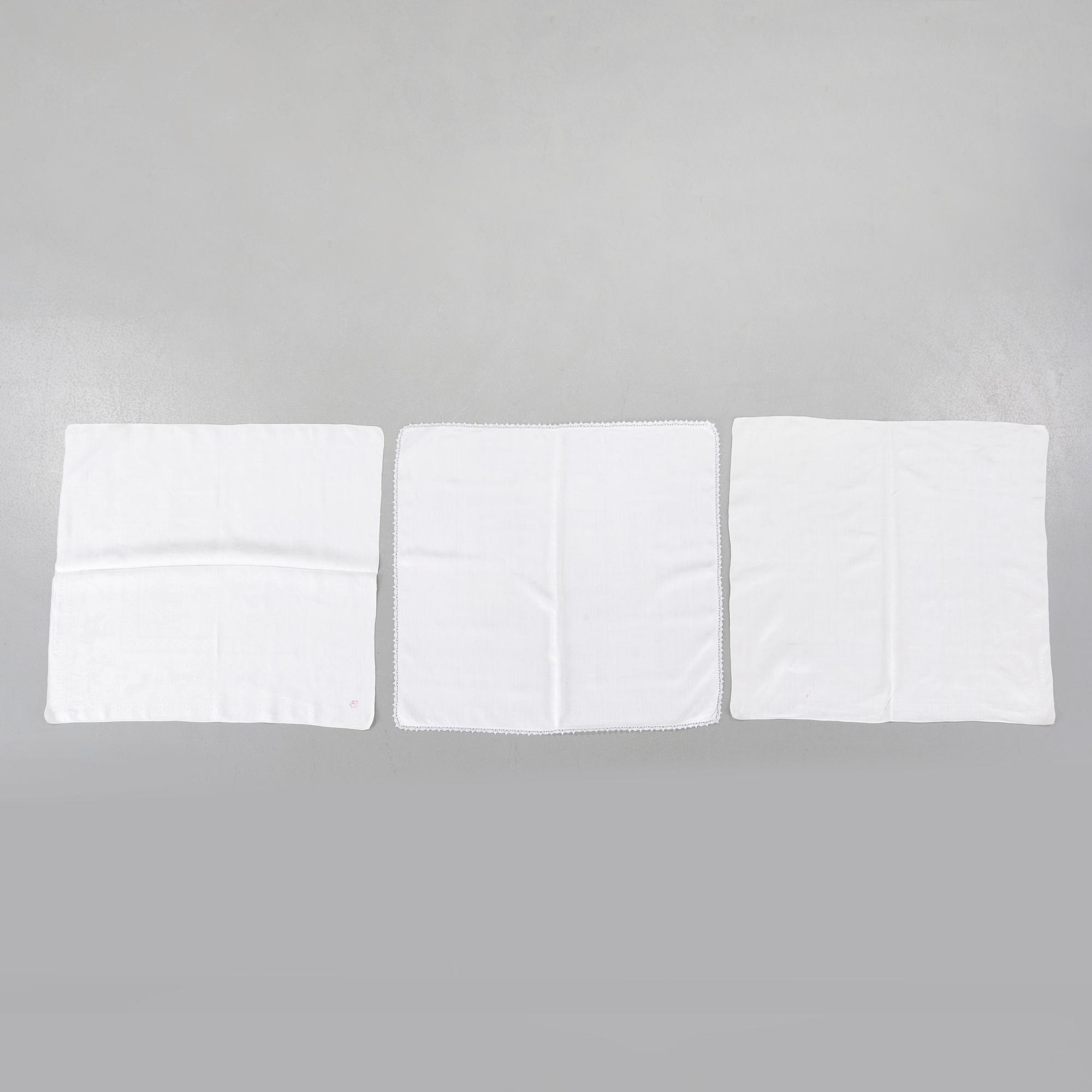 Three 19th century damask napkins.
