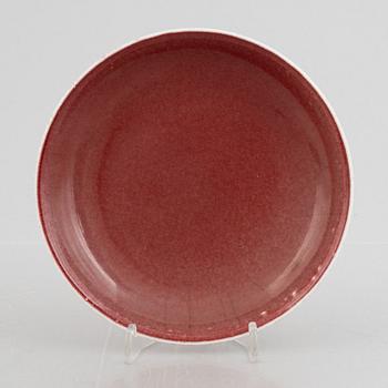 A copper red glazed dish, China, 20th century.