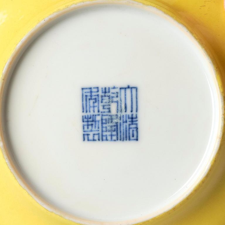 A yellow glazed dish, Qing dynasty with Qianlong mark and of the period (1736-95).