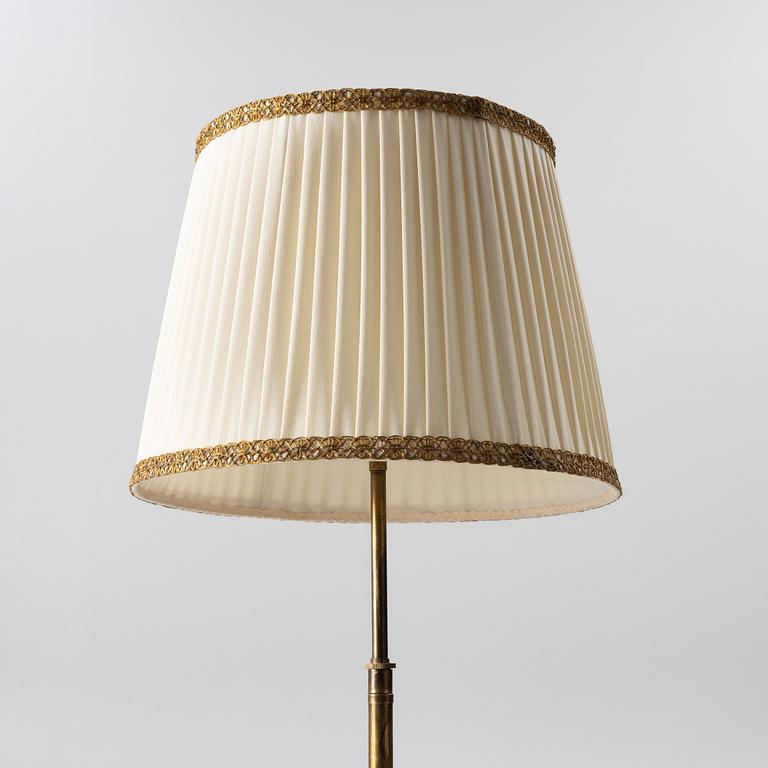 A brass floor lamp, 1940s.