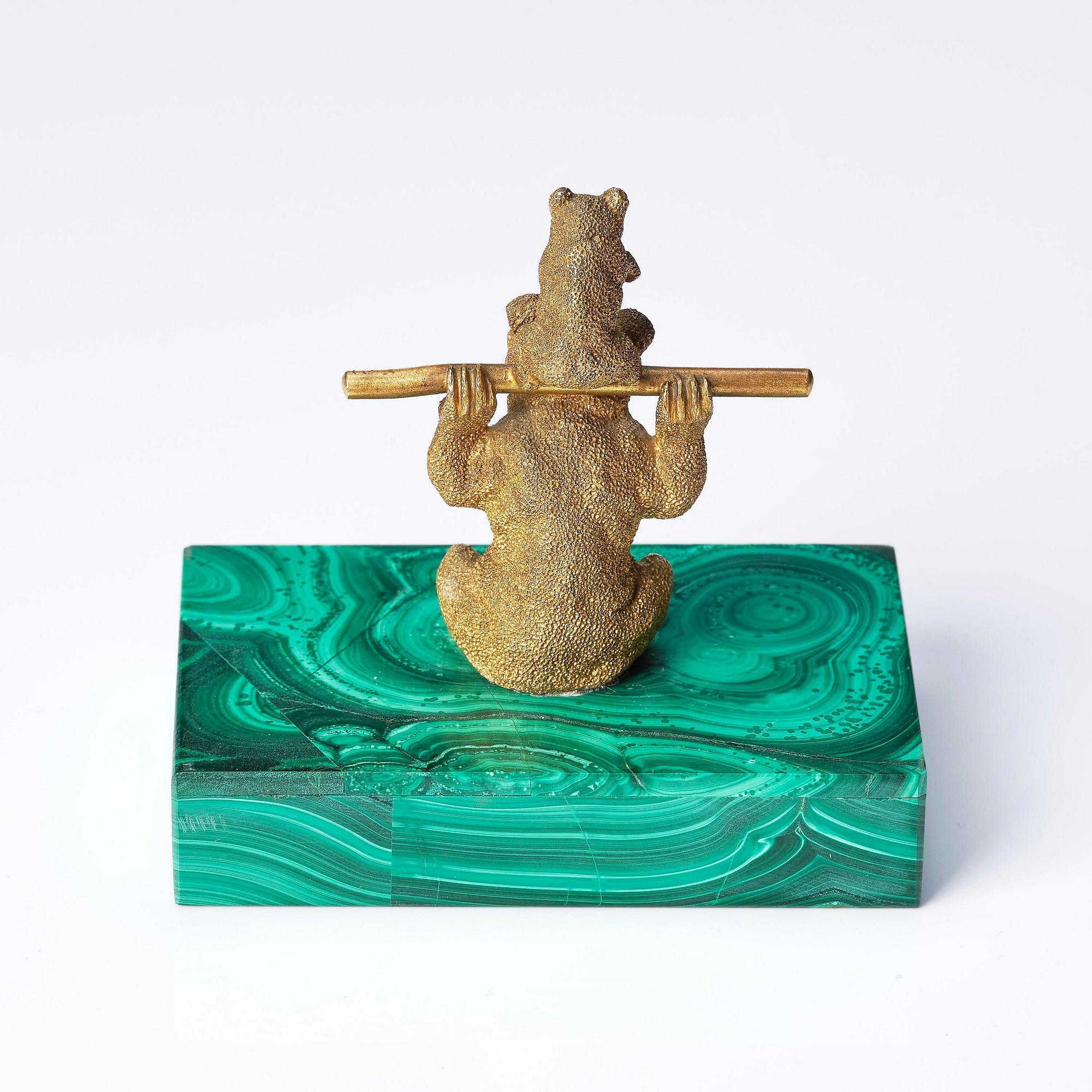 A Russian Nicholas II malachite-veneered and gilt-bronze paperweight, late 19th century.