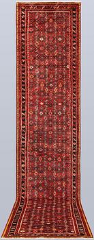 A Hosseinabad runner, approx. 438 x 94 cm.