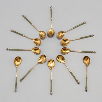 A set of twelve Fabergé silver-gilt and cloisonné enamel tea-spoons small, work master Fedor Rückert, Moscow 1908-1917.