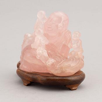 A rose quartz figure of buddai, China, 20th Century.