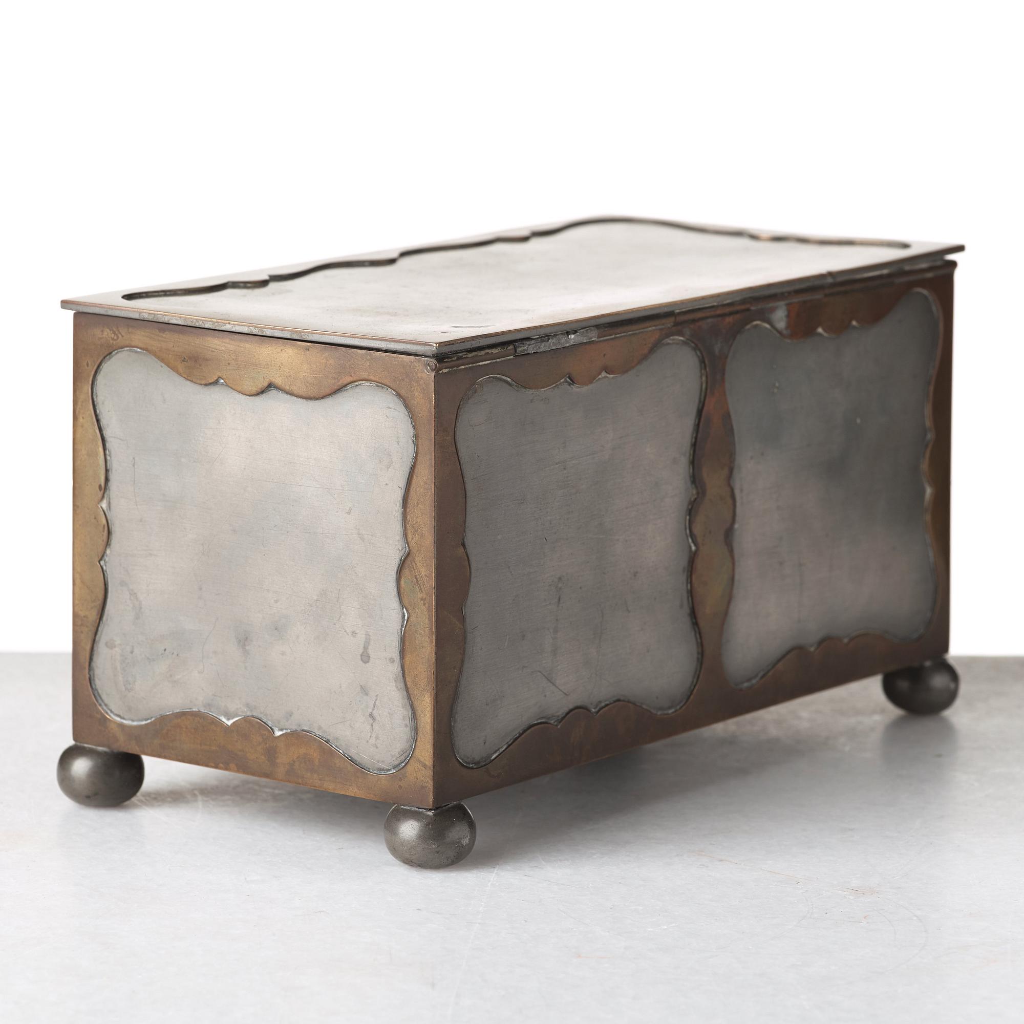 Firma Svenskt Tenn, a pewter and brass box, Stockholm 1930, model A 854.