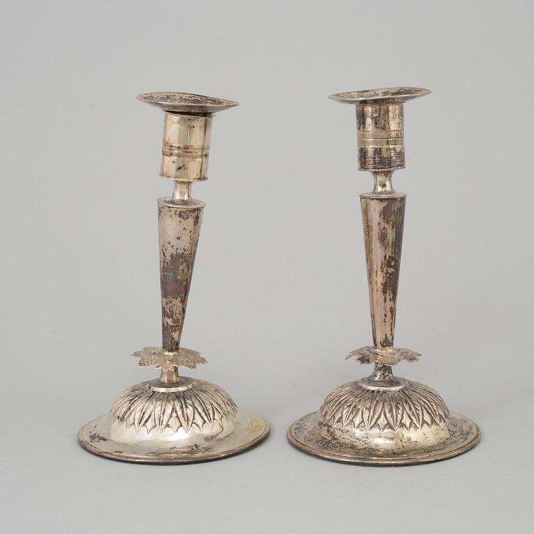 A pair of empire silver candles, presumably Stockholm, dated 1819.