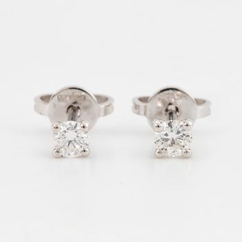 Brilliant-cut diamond stud earrings.