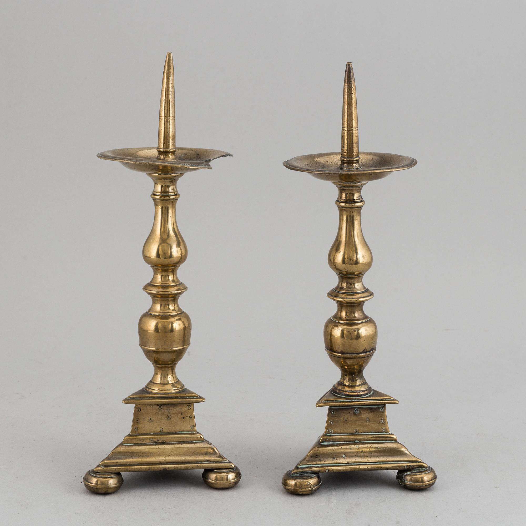 A pair of 17th century bronze candlesticks.
