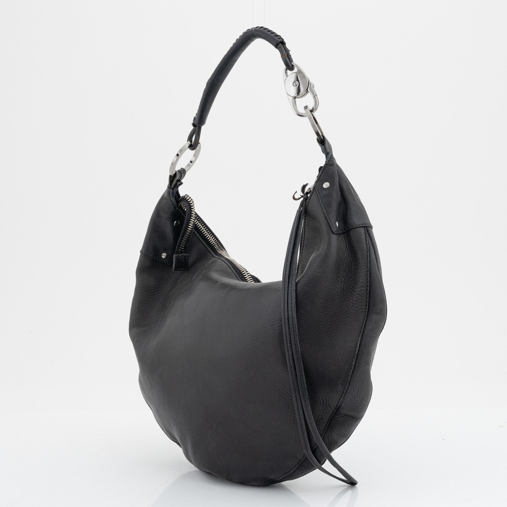 Gucci, a leather bag.