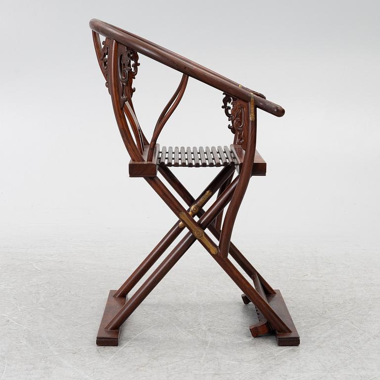 A Chinese hardwood folding chair, 20th century.
