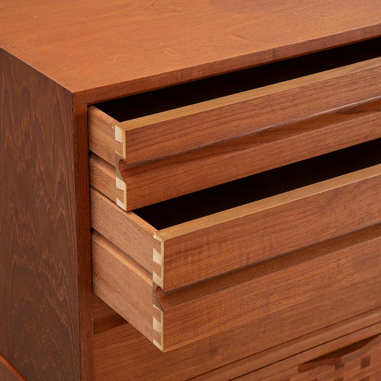 A 1960's teak shelving system by Poul Cadovius.