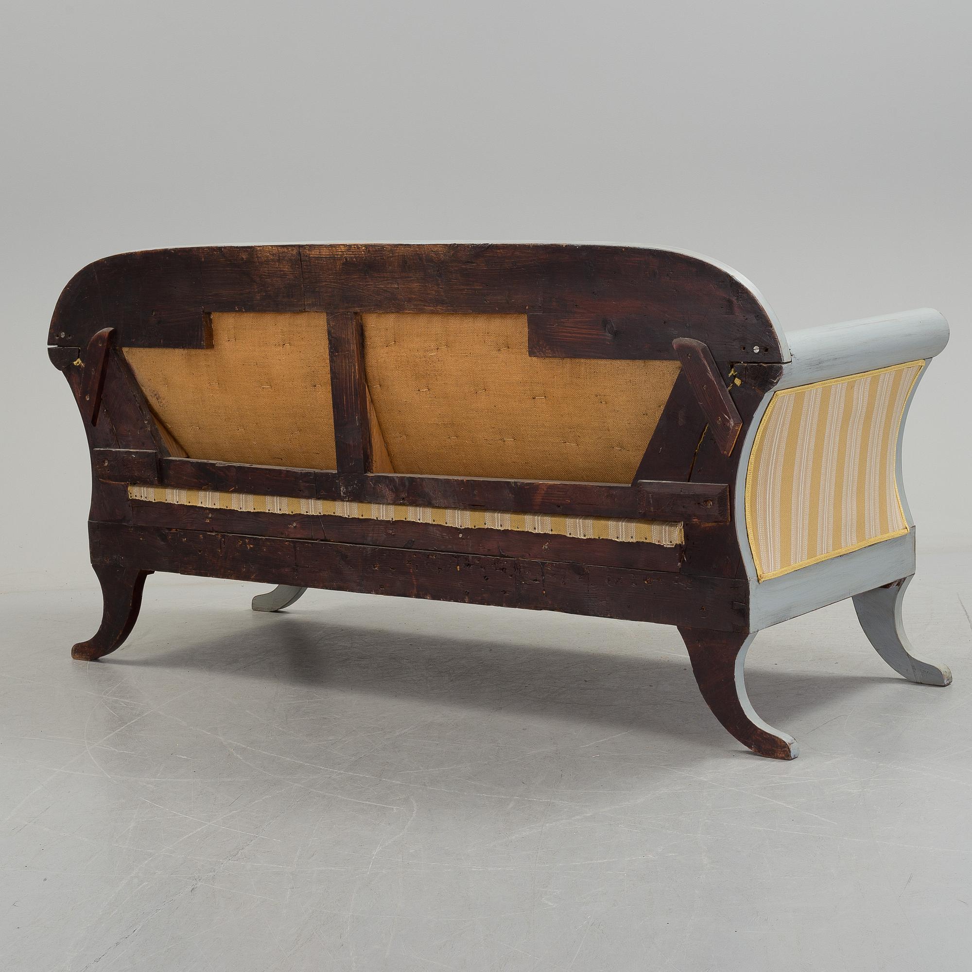 A mid 19th century painted sofa.