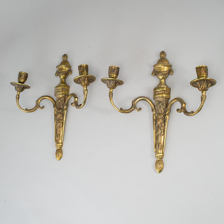 A pair of brass Louis XVI style wall sconces, 20th Century.