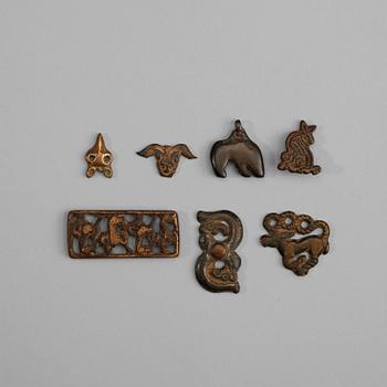 97. A set of seven bronze pendants and garment plaques, Ordo, Warring States (481-221 BC).