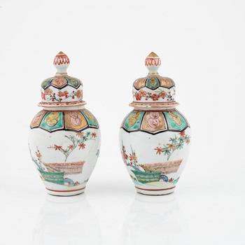 A pair of Japanese jars with covers, circa 1900.