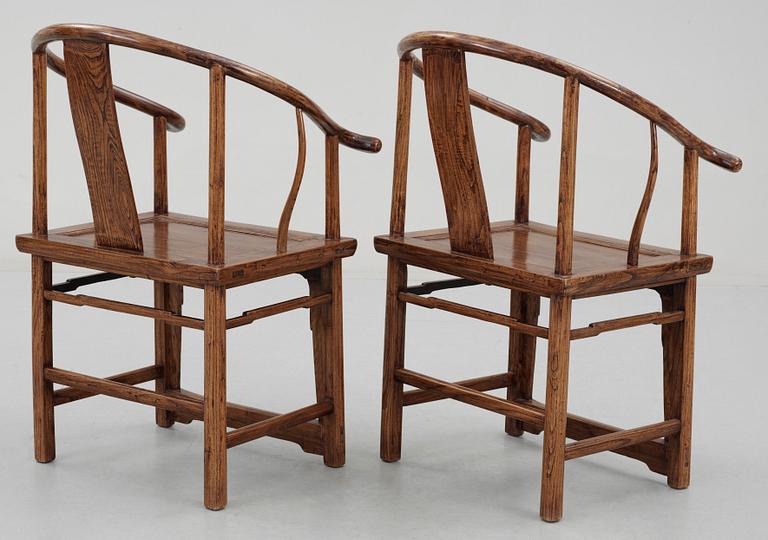 A pair of hardwood horseshoeback armchairs, Qing dynasty.