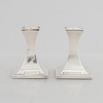 A pair of silver candlesticks, mark of William Hutton & Sons Ltd, Sheffield 1911-1912.