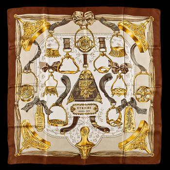 A set of three silk scarves by Hermès, "Etriers" and "Thalassa".