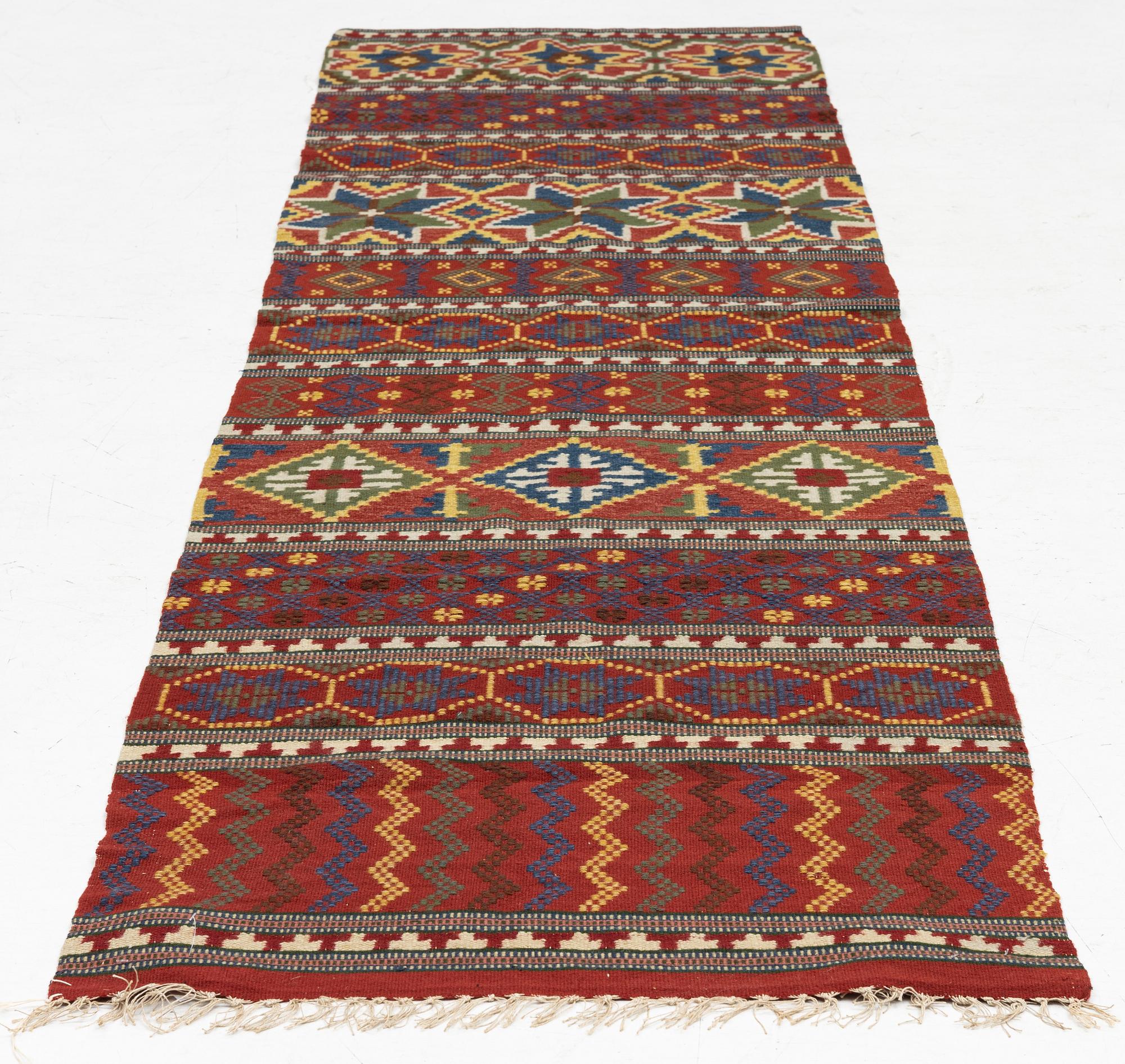 A bench cushion, flat weave, c. 262 x 64 cm, Scania, around the year 1900.