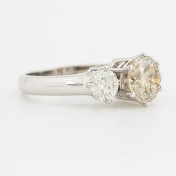 Fancy light yellowish brown round brilliant-cut diamond ring.