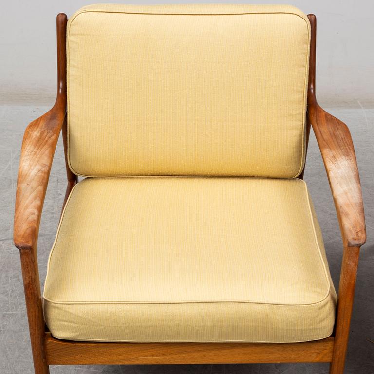 A pair of USA-75 easy chairs by Folke Ohlsson, DUX.