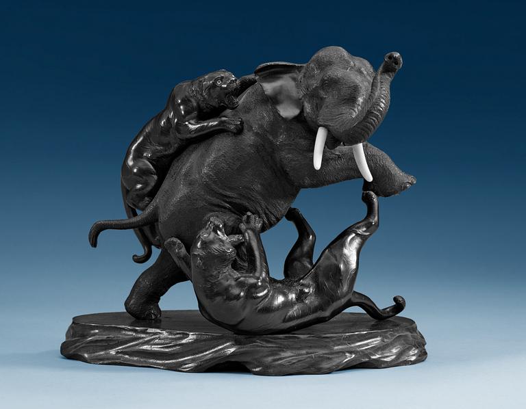 A Japanese bronze figure of tigers attacking an elephant, ca 1900.