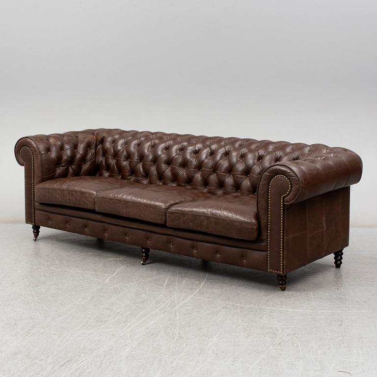 A modern chesterfield sofa.