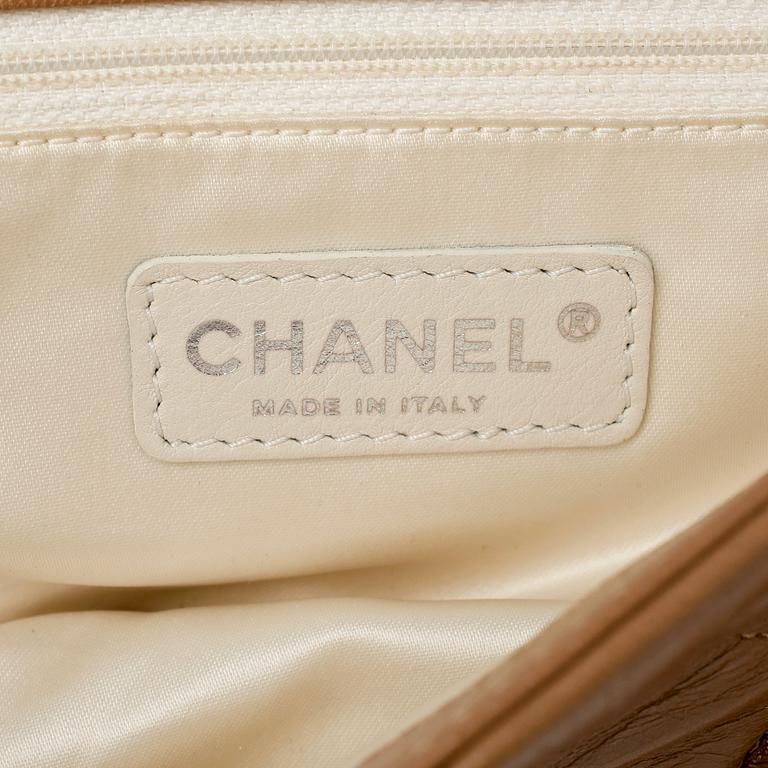 CHANEL, a beige quilted leather flapbag.