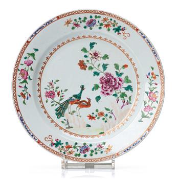 729. A round famille rose 'double peacock' serving dish, Qing dynasty, Qianlong (1736-95).