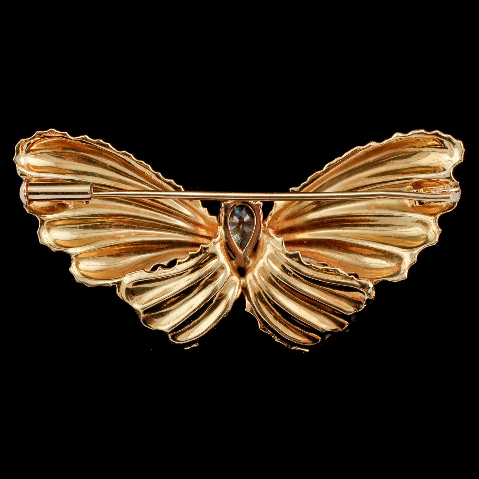 BROSCH, 18k guld med fasettslipat glas, importstämplad, 1900-talets tredje kvartal. Vikt 5 g.