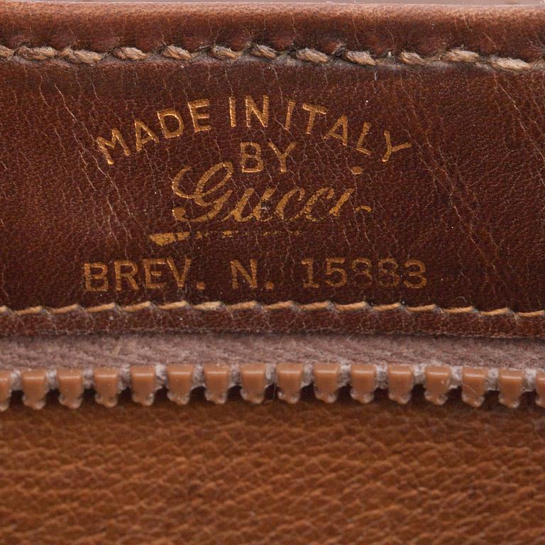 GUCCI, a brwon leather shoulder bag from the 1970s.