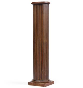 45. A Swedish Empire column-shaped cabinet, first part 19th century.