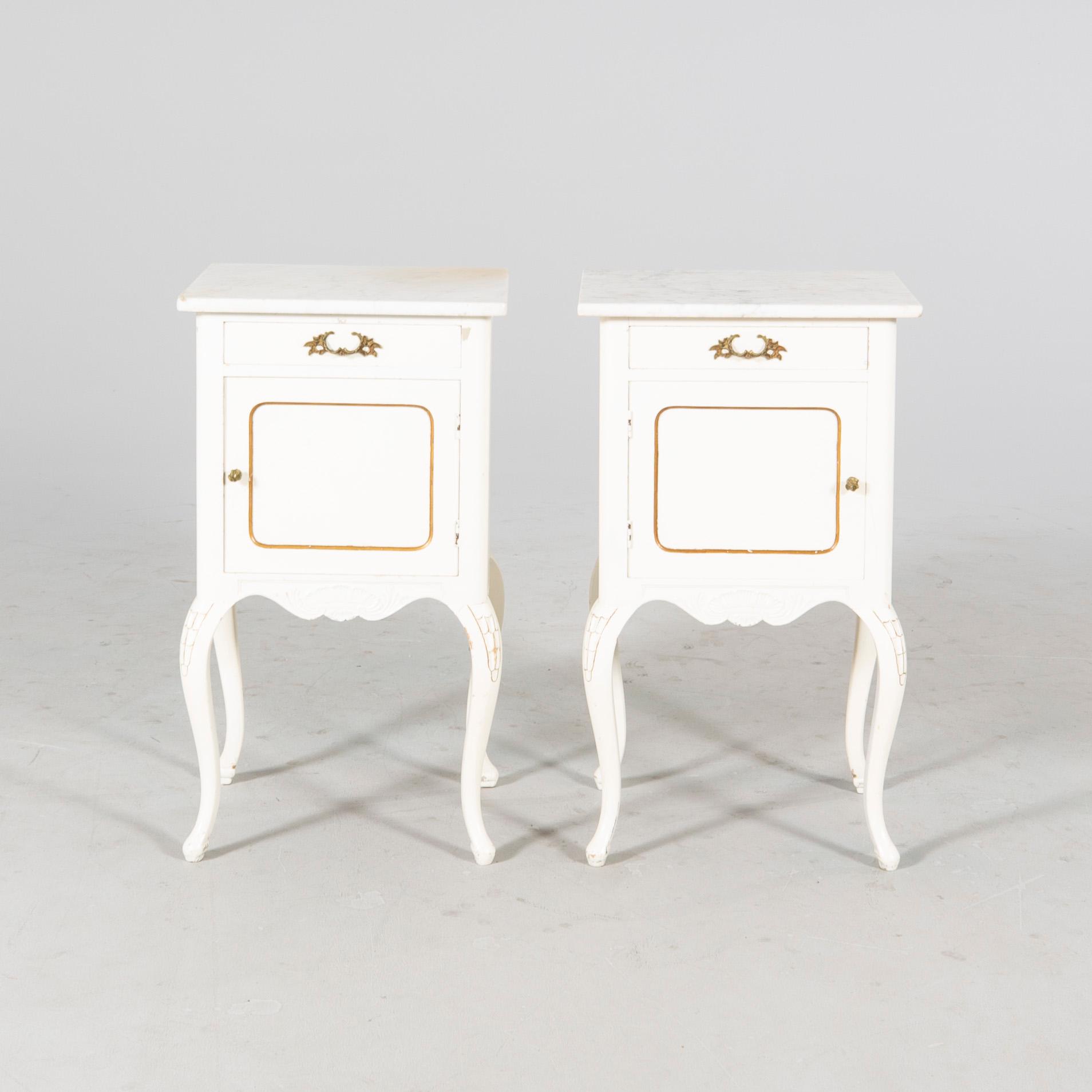 A pair of painted Rococo style bedside tables mid 1900s.