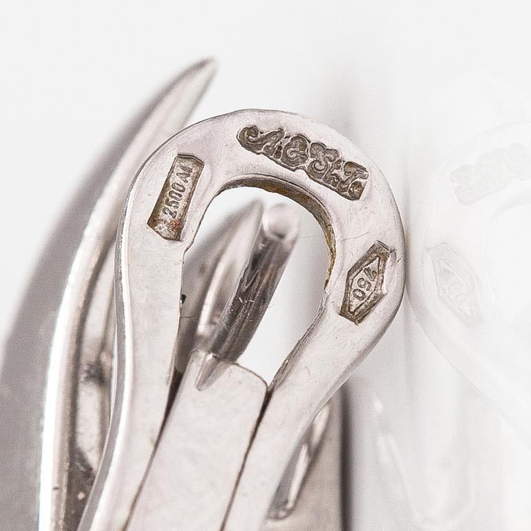 A pair of 18K white gold earrings and a ring with diamonds ca. 0.90 ct in total. Moscow.
