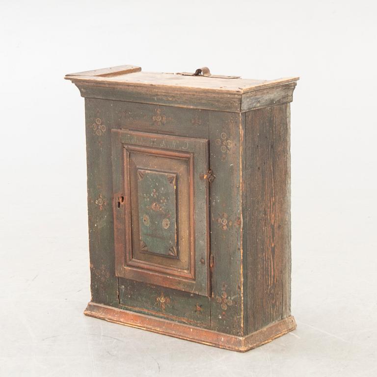A Swedish painted wall cabinet around 1800.