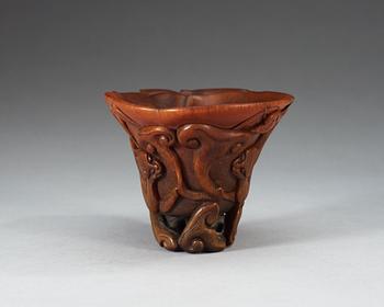 A finely carved rhinoceros libation cup, Qing dynasty, Kangxi (1662-1722).