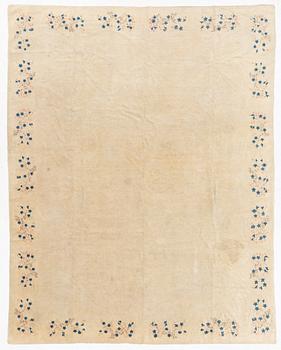 An Antique Peking rug, northern China, c 344 x 240 cm.