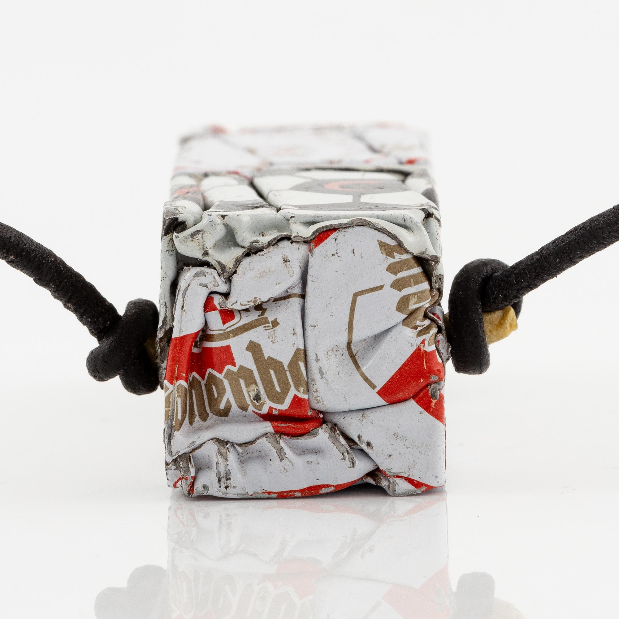 César Baldaccini, compression, pendant made of compressed beer bottle caps.