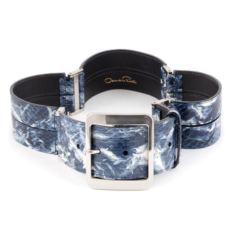 OSCAR DE LA RENTA, a blue snakeskin belt.