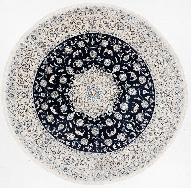 A Nain rug, diameter 243 cm.