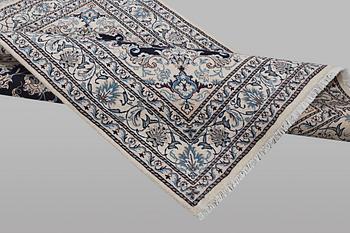 A rug, Nain, part silk, ca 198 x 144 cm.