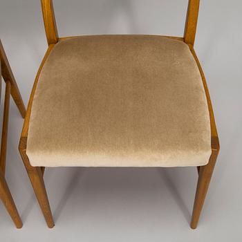 A set of four 1960s oak chairs.