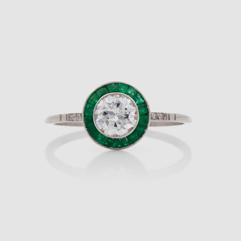 A emerald and diamond, circa 0.62 ct, circa quality G-H/SI, ring.