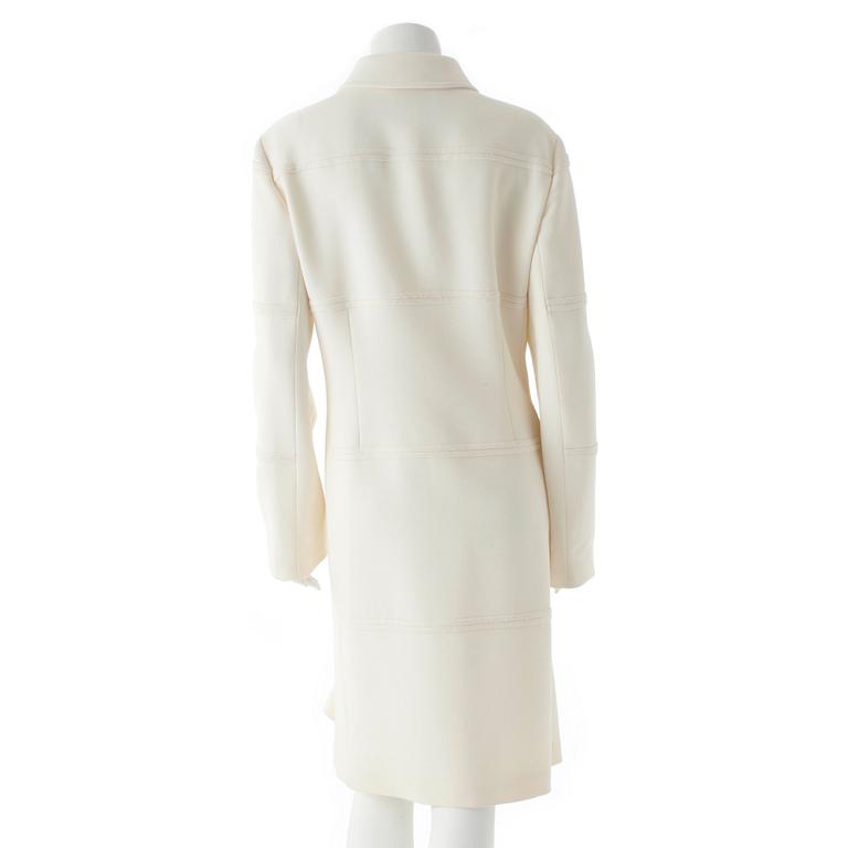 CARACTÈRE, a white wool coat.