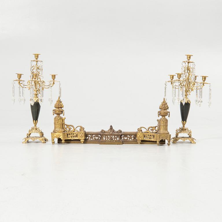 Pair of candelabra and a firedog, 18th/19th century.